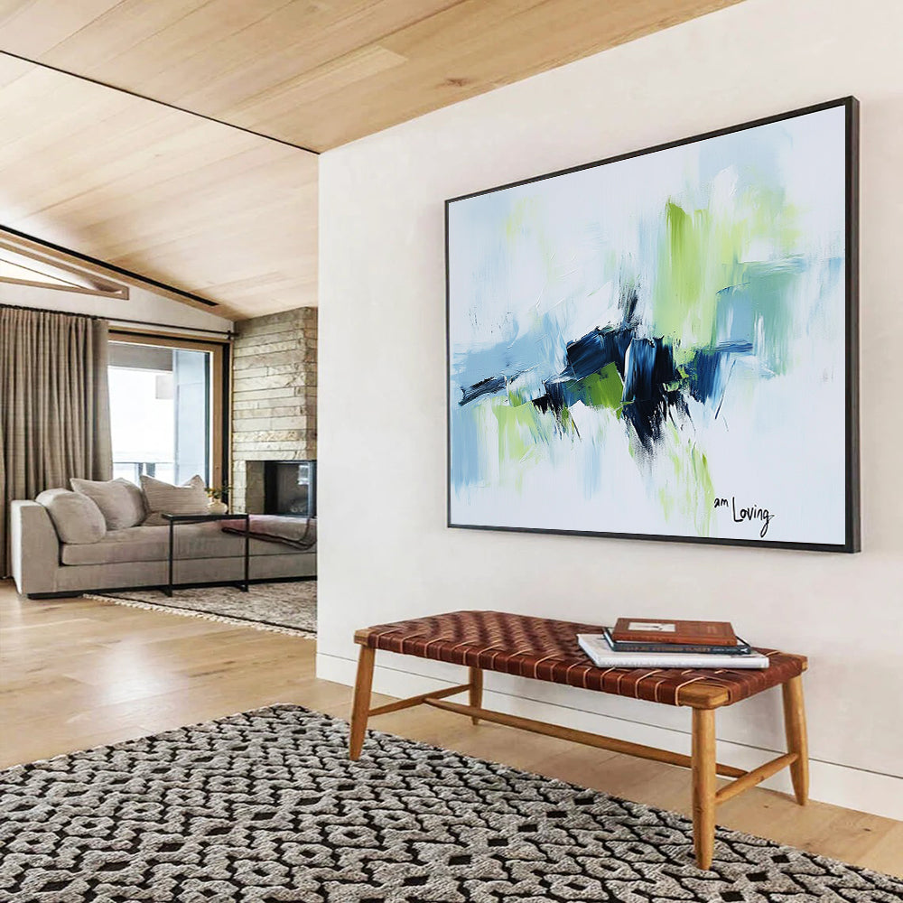 Abstract painting with a white background highlighted by light blue and green accents features expressive brush strokes and the words am loving.SC214