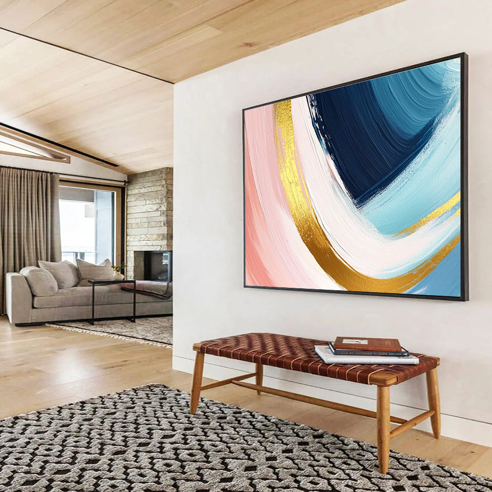 A large abstract painting in pastel pink blue and yellow with dynamic brushstrokes and gold outlines evoking joy and warmth.SC443