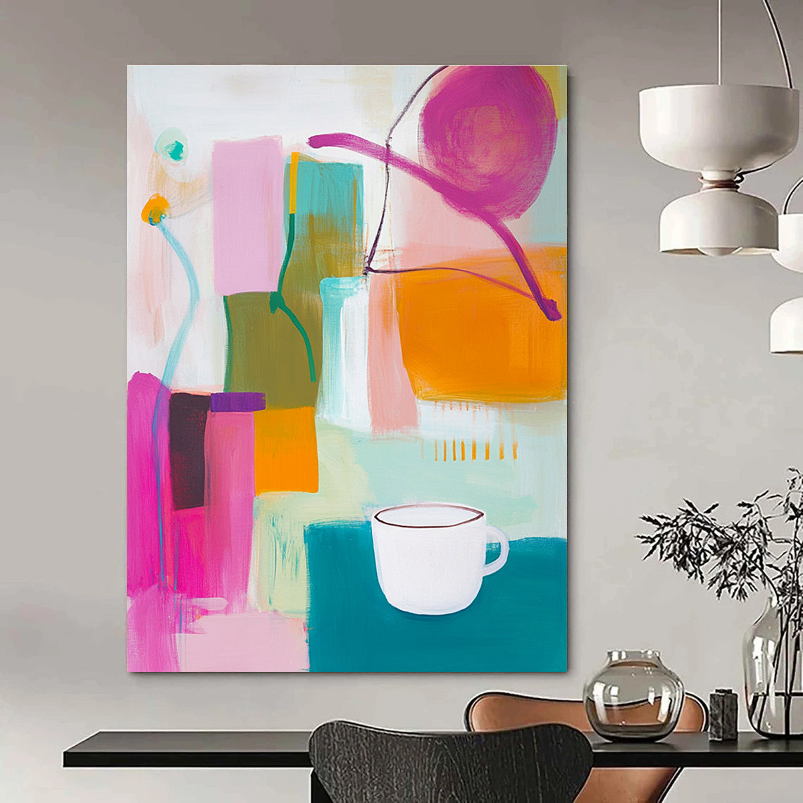 An abstract painting features vibrant pink green and yellow shapes with an orange object and a white cup on top alongside blue and purple lines.STSC787