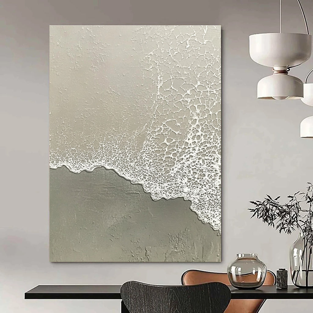 Abstract painting depicting the serene transition of water meeting sand with muted tones of grayish-white and light green.STSC955