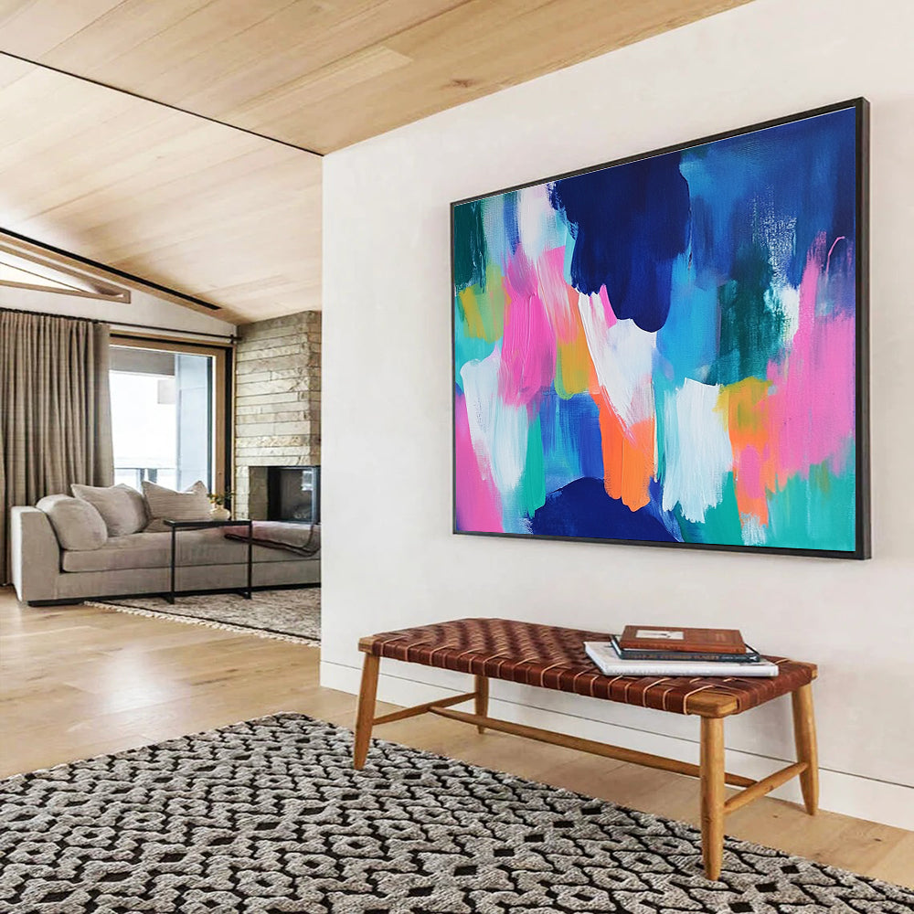 A large abstract painting with bold blue and pink backgrounds and bright orange, green, and turquoise foregrounds, conveying energy and movement.SC562