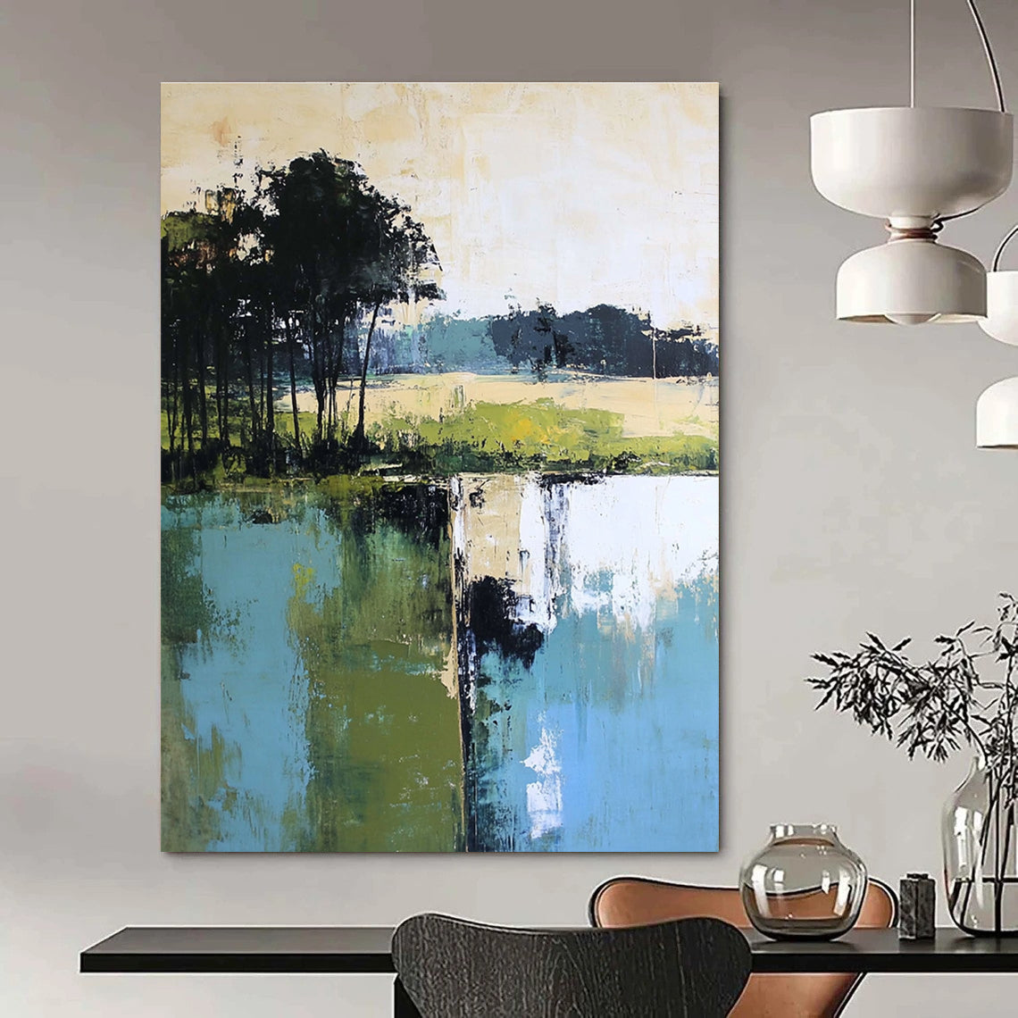 Large abstract painting featuring green blue and beige hues with distant trees foreground trees and green grass by the water.STSC098