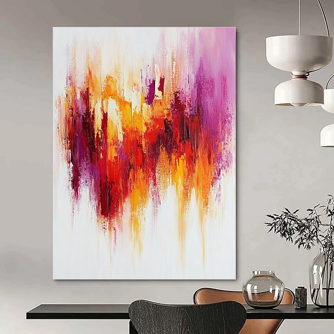 Large abstract painting with textured brush strokes in warm reds and yellows accented by purple on a white background creating a happy uplifting mood.STSC814