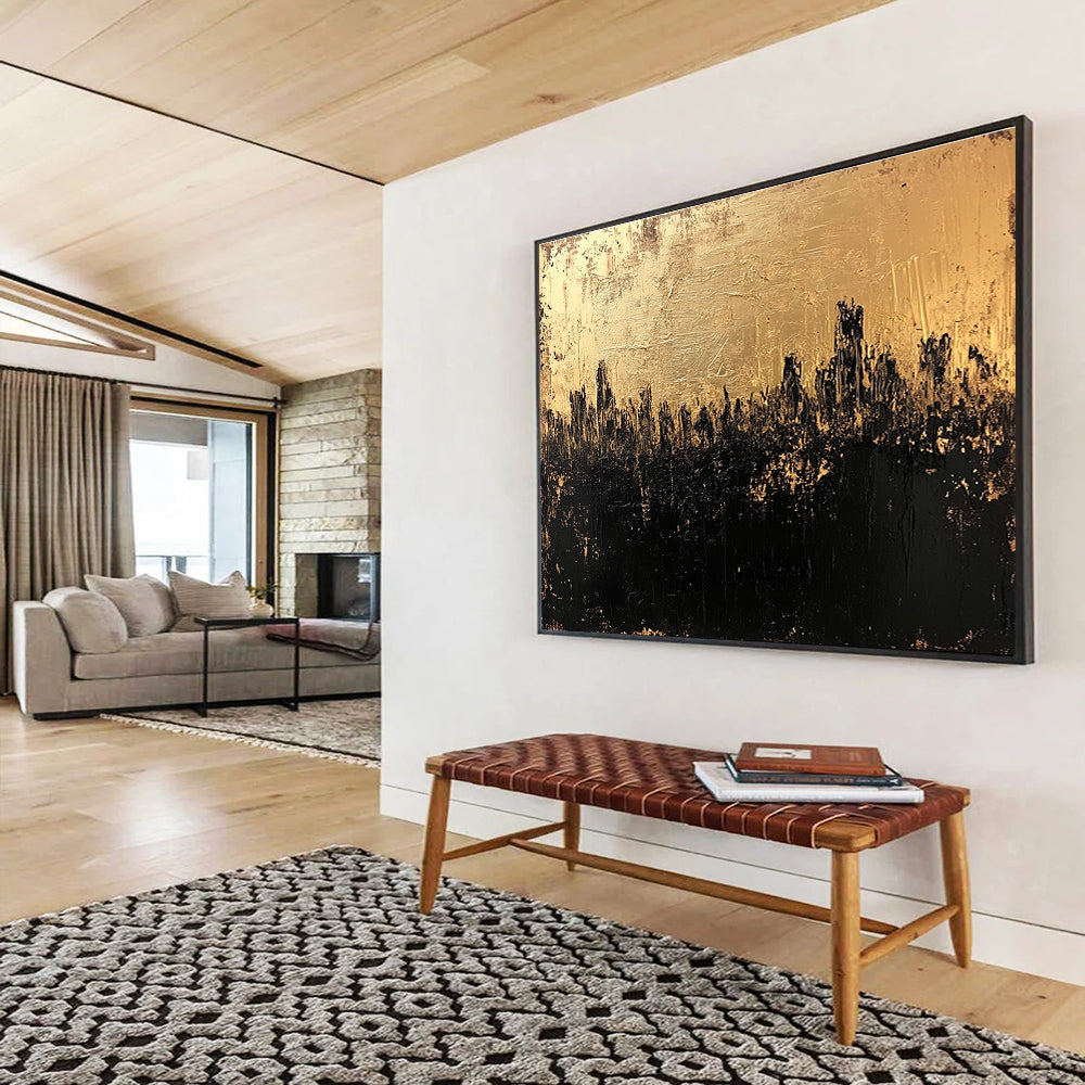 Large abstract painting in gold and black featuring a textured surface that captures a dark cityscape with an atmospheric moody quality.SC143