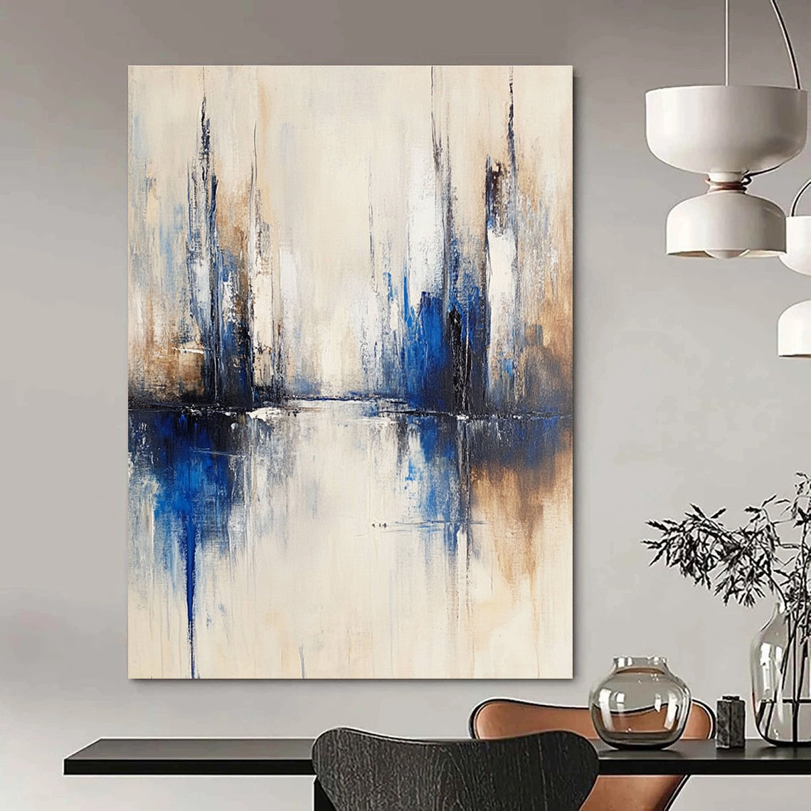Large abstract painting of a city with muted white and blue tones on a beige background featuring blurred brush strokes reflecting in water.STSC134
