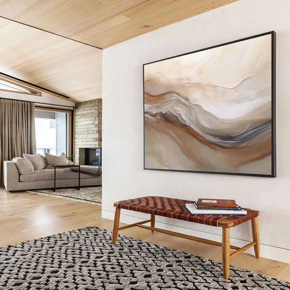Large abstract painting featuring swirling beige and white hues resembling desert dunes capturing movement and depth in a serene landscape.SC447