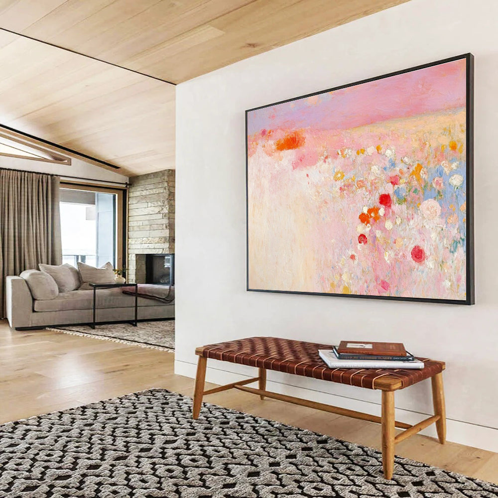 Large abstract painting in soft pink and white with hints of red and yellow evokes springtime calmness amidst a blooming field.SC350
