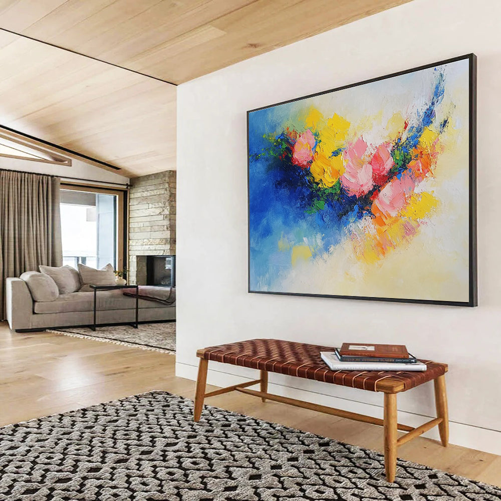 Large abstract painting of flowers in vibrant yellow, blue, and pink featuring textured palette knife techniques. Perfect for modern decor.SC190