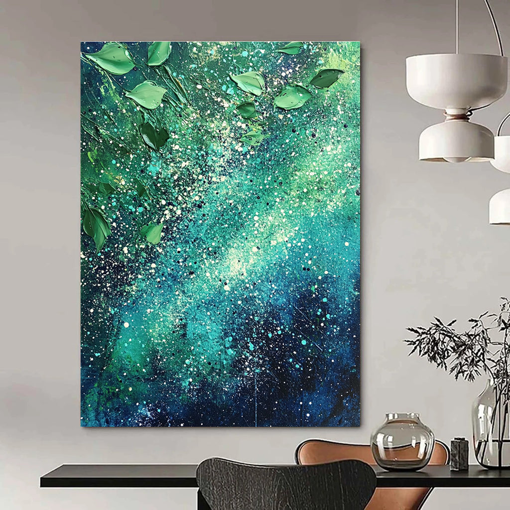 Large abstract painting of the Milky Way featuring vibrant green and blue hues with white speckles and scattered leaves for texture and cosmic beauty.STSC065