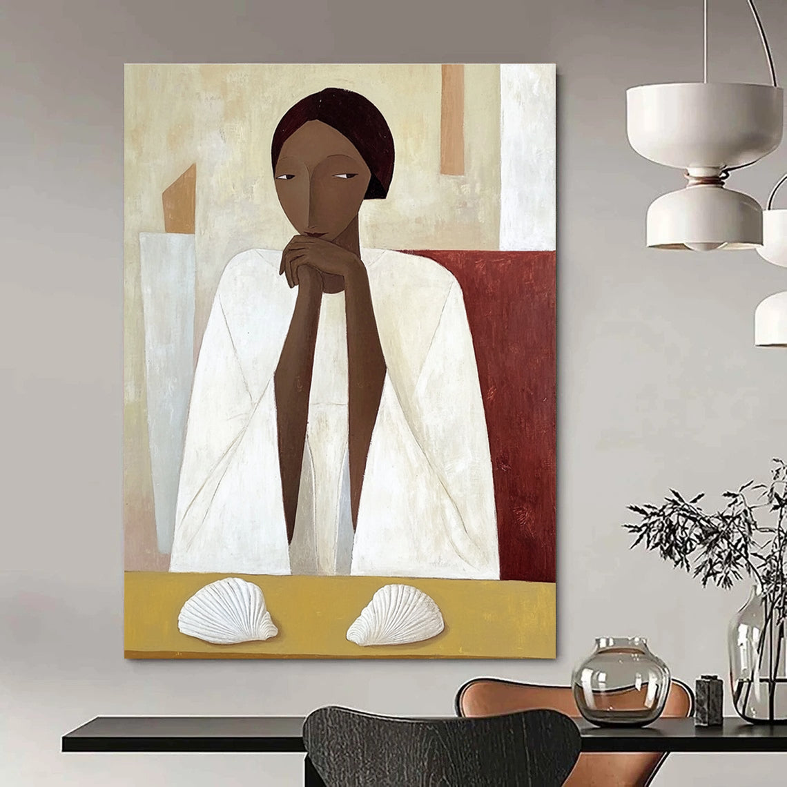 A large abstract painting featuring an African woman in a white cloak sitting on a yellow table with shells in daylight.STSC1115