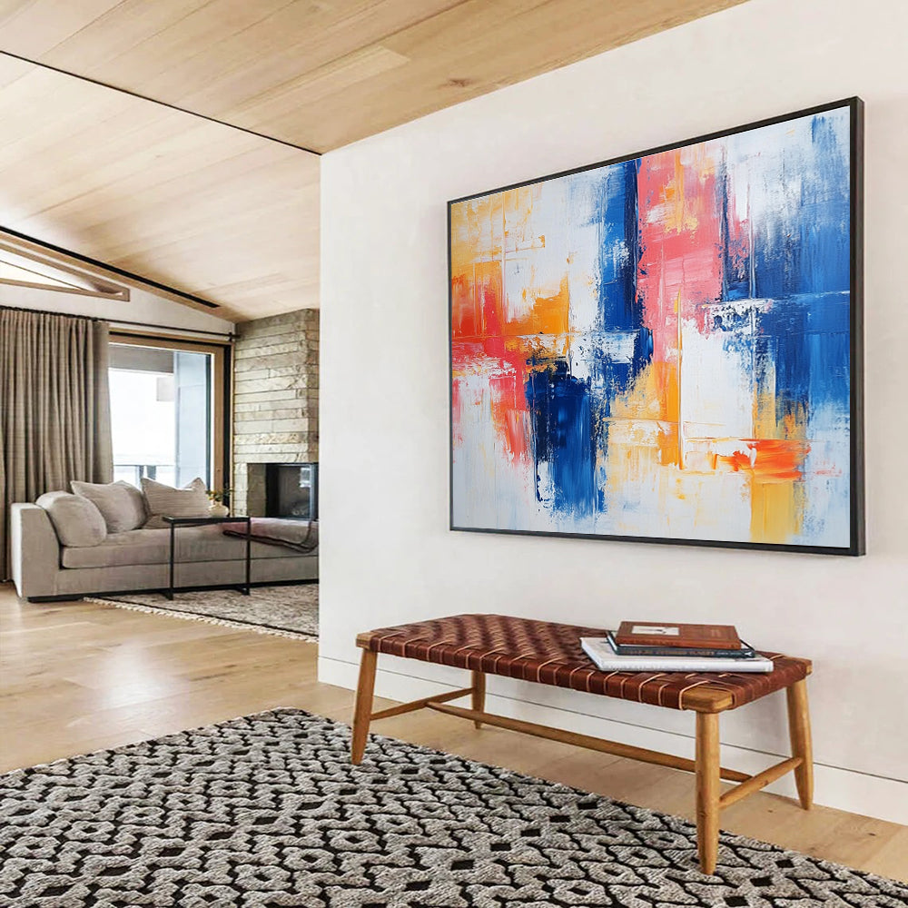 Large abstract painting with vibrant blue and red brush strokes on white, featuring yellow highlights and textured layers that evoke nostalgia and joy.SC263