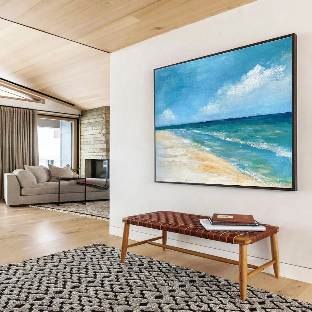 A large abstract painting of the ocean sky and sandy beach in muted blue tones with green accents and soft clouds for a serene ambiance.SC362