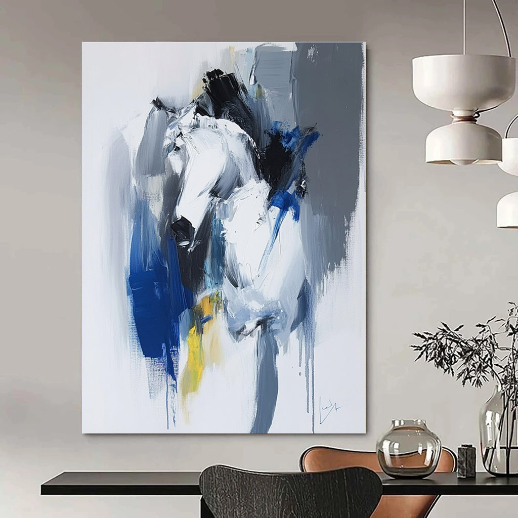 Large abstract painting in blue and white with dynamic brushstrokes reveals movement and emotion featuring elements of strength and energy.STSC036