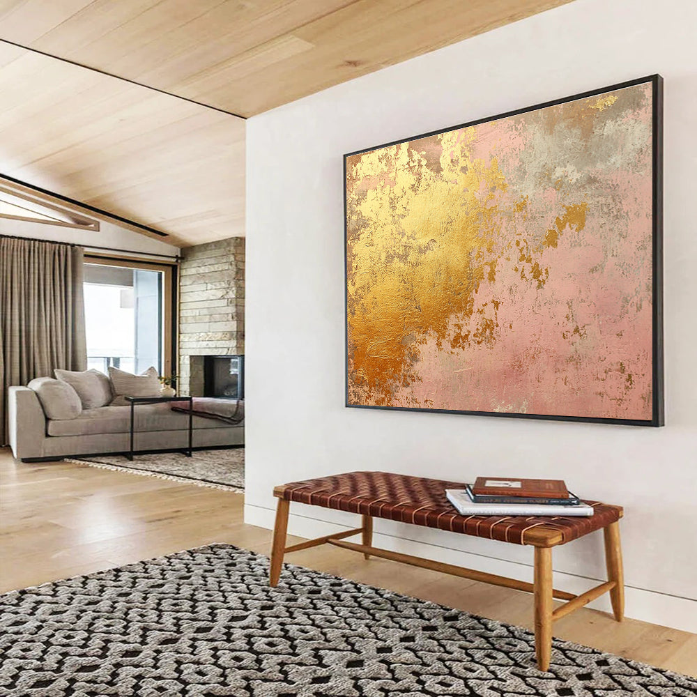 A large abstract canvas in soft pink and gold tones evokes rustic charm with weathered texture and hints of rust, ideal for home decor.SC480