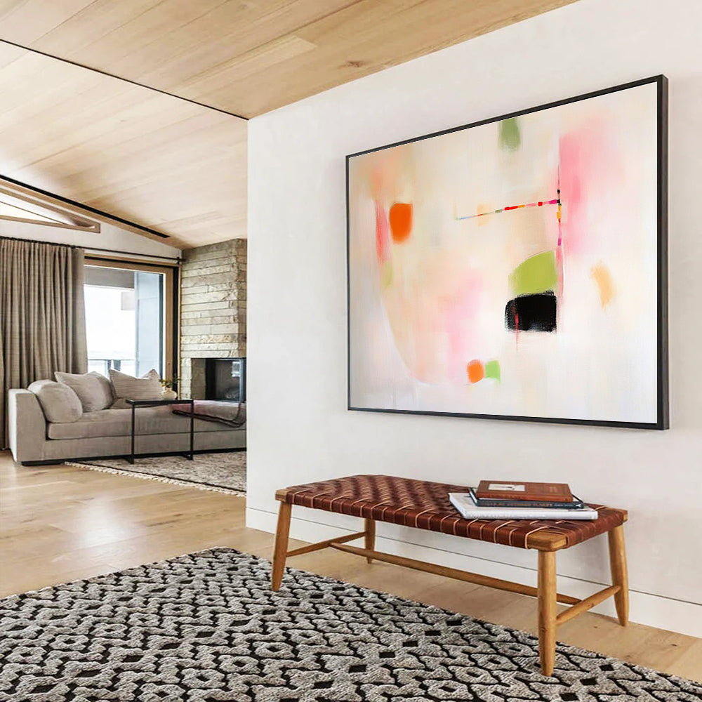 Large abstract painting featuring pink green and orange shapes on white background evoking calmness with gentle curves and contrasting black spaces.SC379
