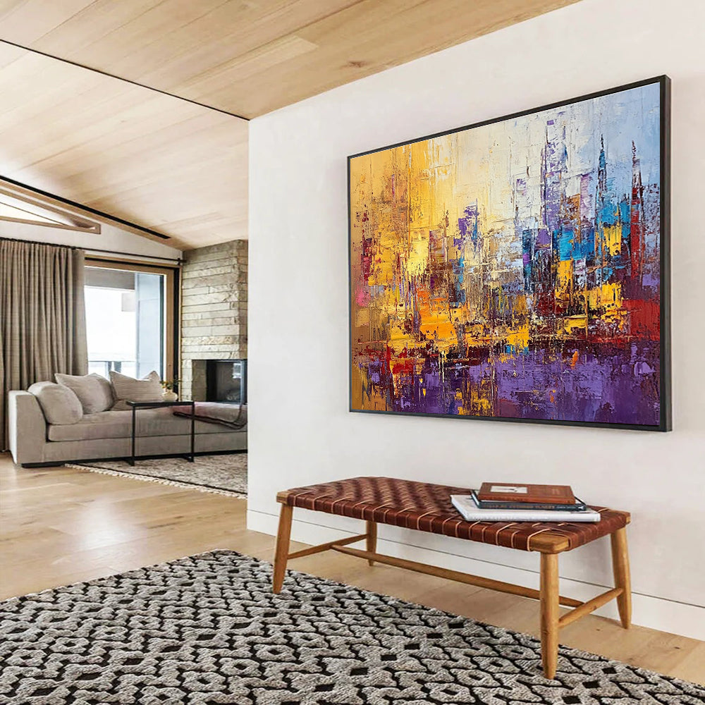 Large abstract painting of a vibrant cityscape in textured gold blue purple and red with impasto strokes and palette knife techniques.SC355
