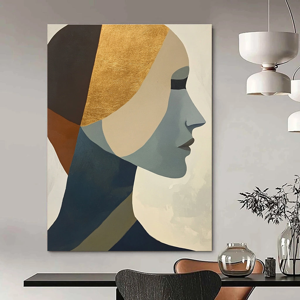 Large abstract painting featuring cubist shapes and lines muted colors gold foil accents and a hint of the female form.STSC692