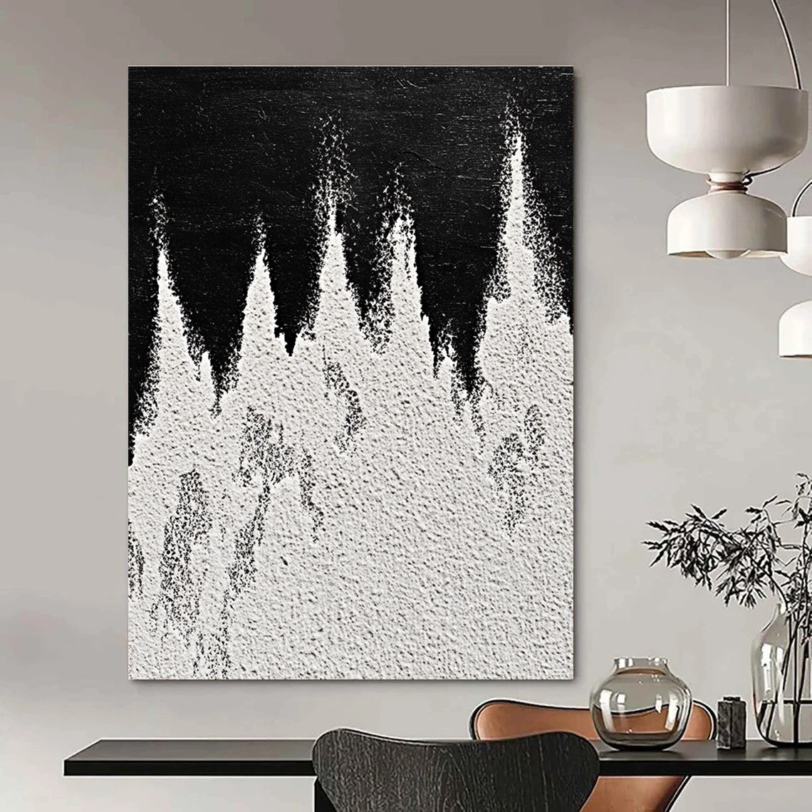 A large abstract painting featuring white powder on a black background with textured mountain ranges in playful gray and white tones capturing sharp edges.STSC1487