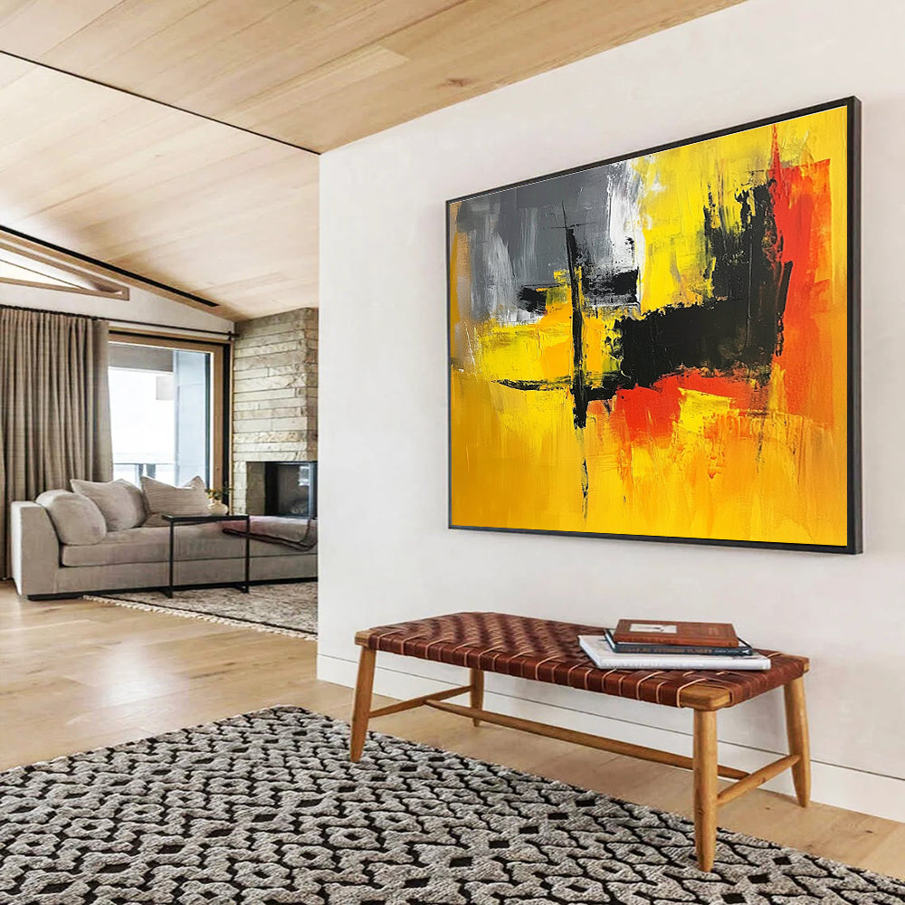 A large abstract painting featuring vibrant yellow, grey, and black hues, perfect for enhancing any contemporary space.SC393