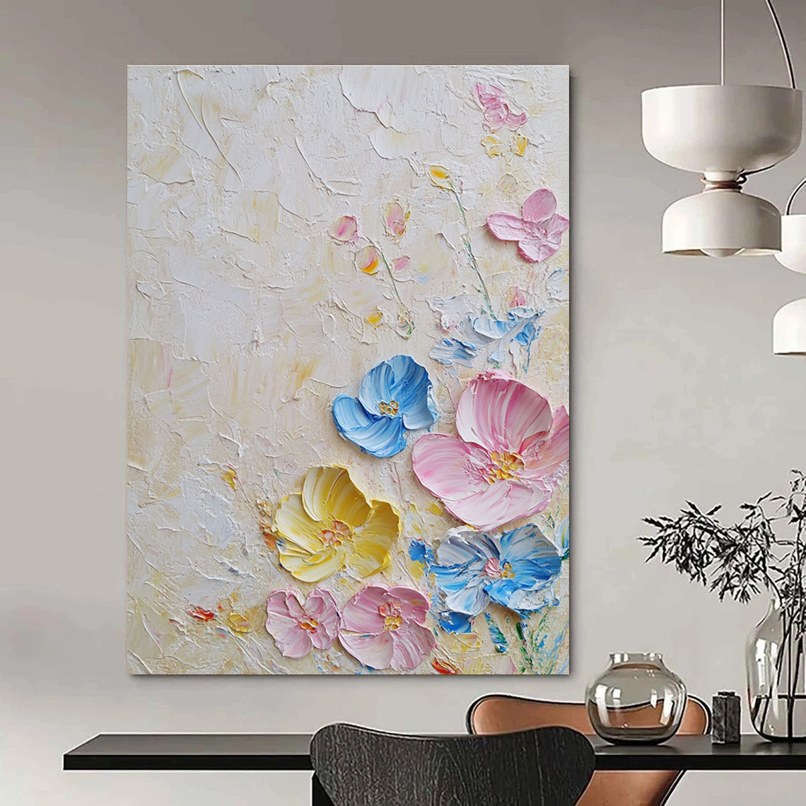 Large abstract painting with textured layers featuring pastel flowers in pink and blue on a white background illuminated by soft lighting.STSC1366