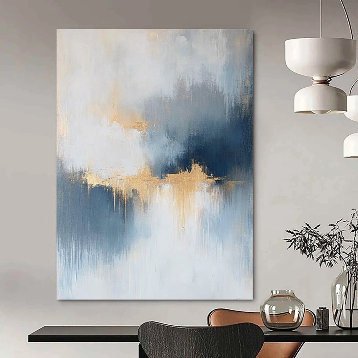Large abstract painting featuring atmospheric clouds in soft blue gray and white tones with gold and silver accents and delicate textures.STSC386