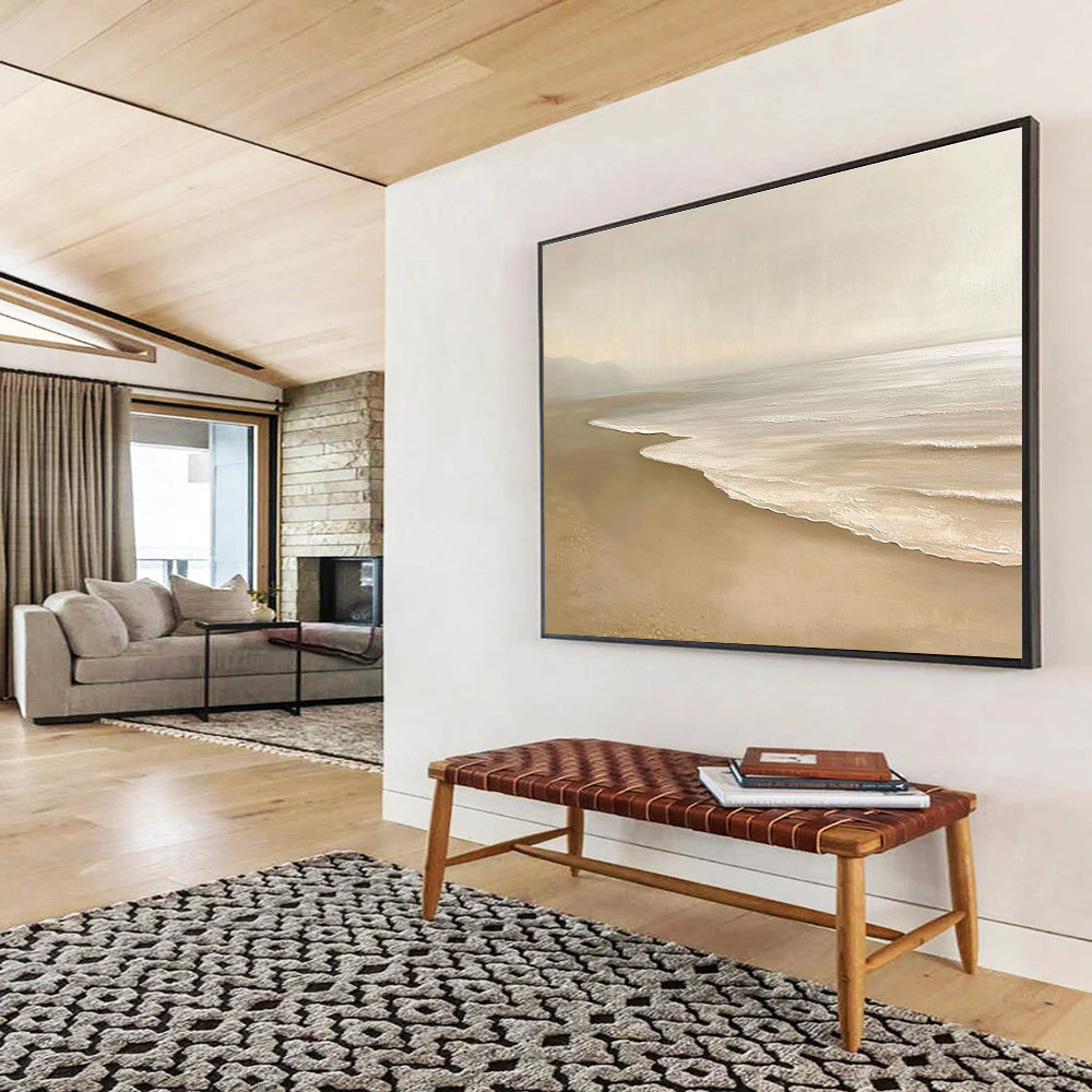 Large abstract painting featuring a serene beach with beige and white tones capturing gentle waves and soft sand in a tranquil setting.SC424