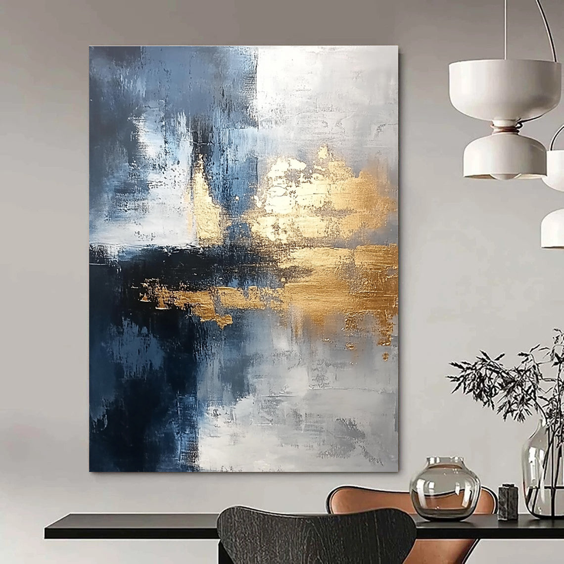 Large abstract painting blending silver and gold with gray blue tones and light brushstrokes featuring exquisite details and a unique composition for a calming atmosphere.STSC376