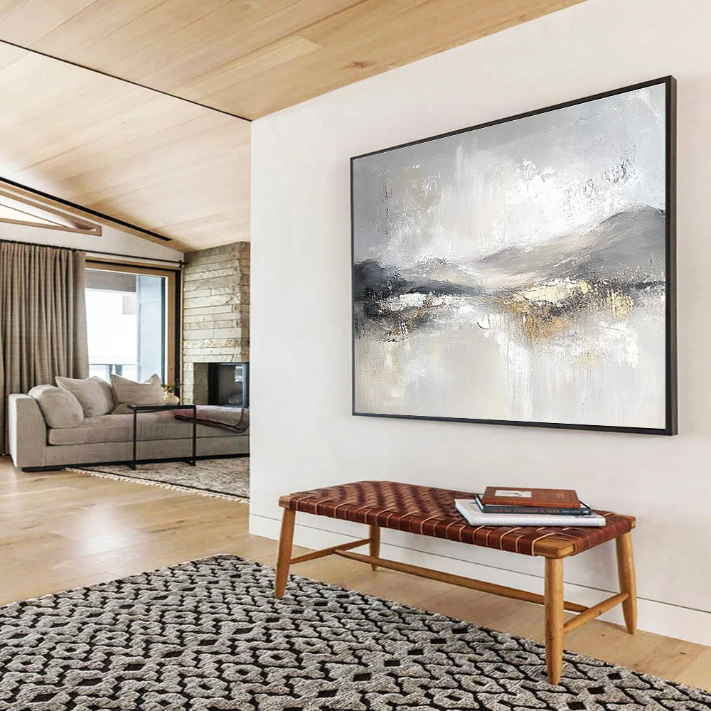 Large abstract painting featuring soft gray and white tones with subtle textures of snow-covered hills and ethereal clouds for a calming atmosphere.SC083