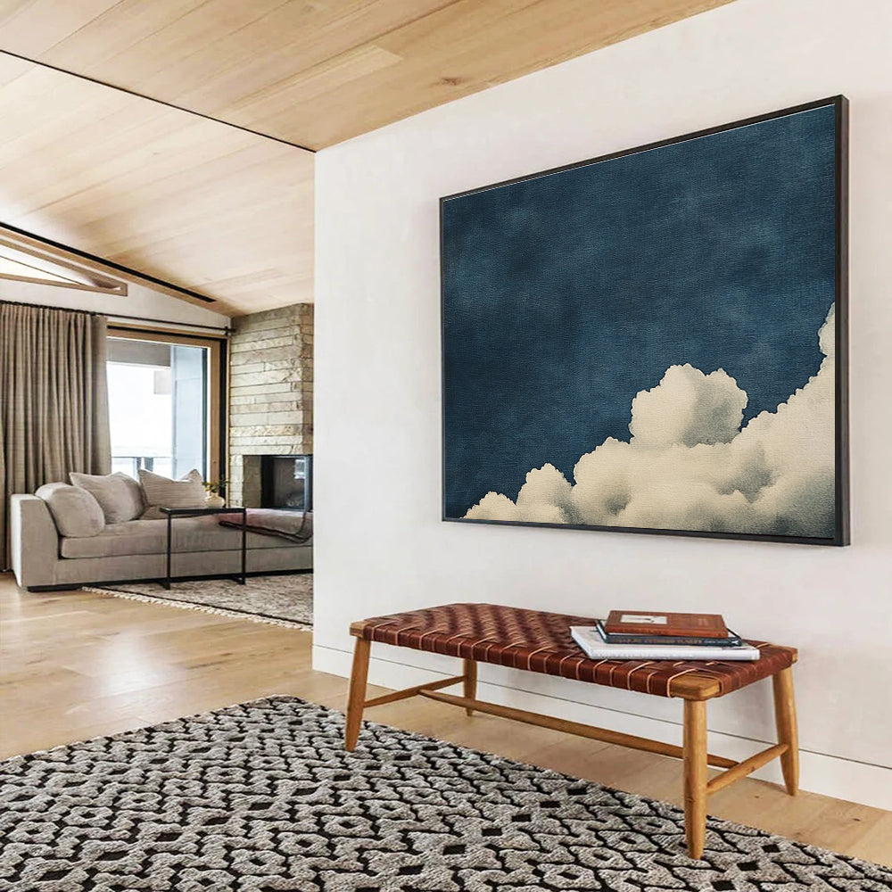 Large abstract painting of clouds on textured canvas featuring high contrast white clouds against a minimalist dark blue background.SC523