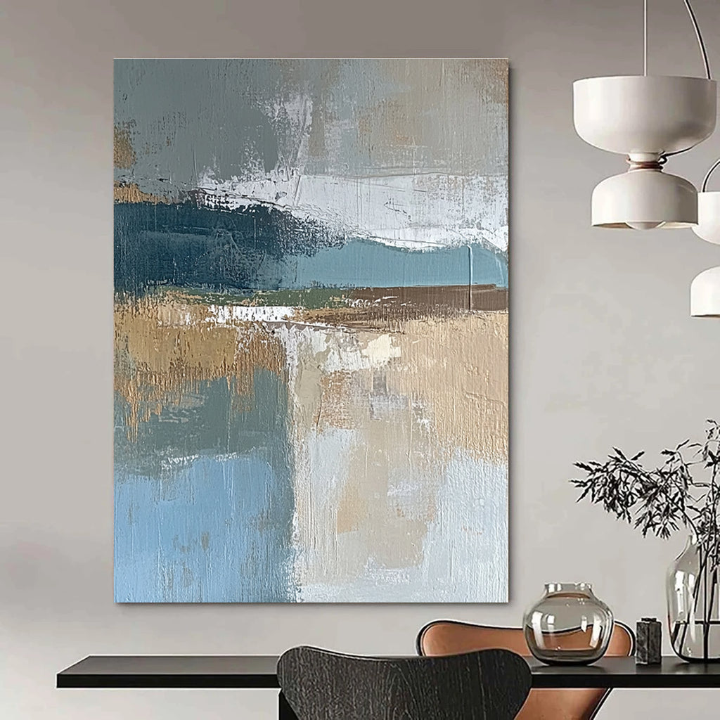 Large abstract painting featuring muted blue gray and brown tones with textured brushstrokes and earthy accents in green and beige.STSC563