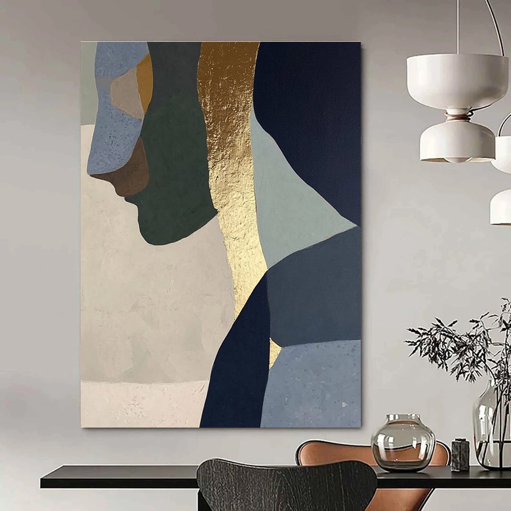Abstract painting with gold foil depicting a woman in profile, blended neutral tones of sage green, blue, gray, beige, and navy blue.STSC756