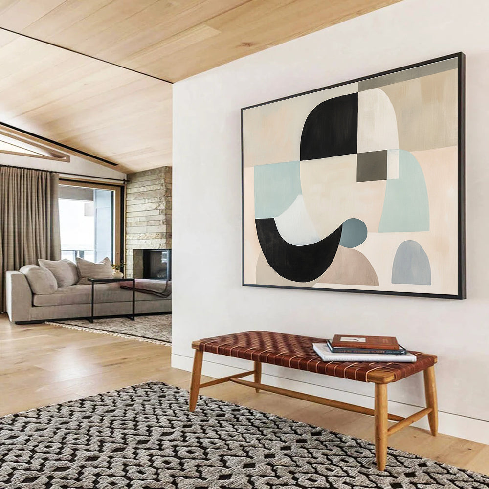 Large abstract painting with white, black, and grey shapes in soft pastel colors featuring geometric forms and a neutral beige background.SC510