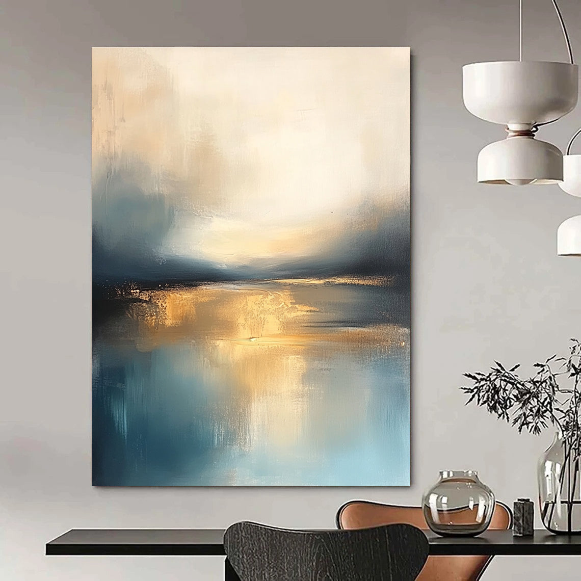 Large abstract painting featuring soft blue and gold tones with a calm sea reflections dramatic clouds and a tranquil sky.STSC103