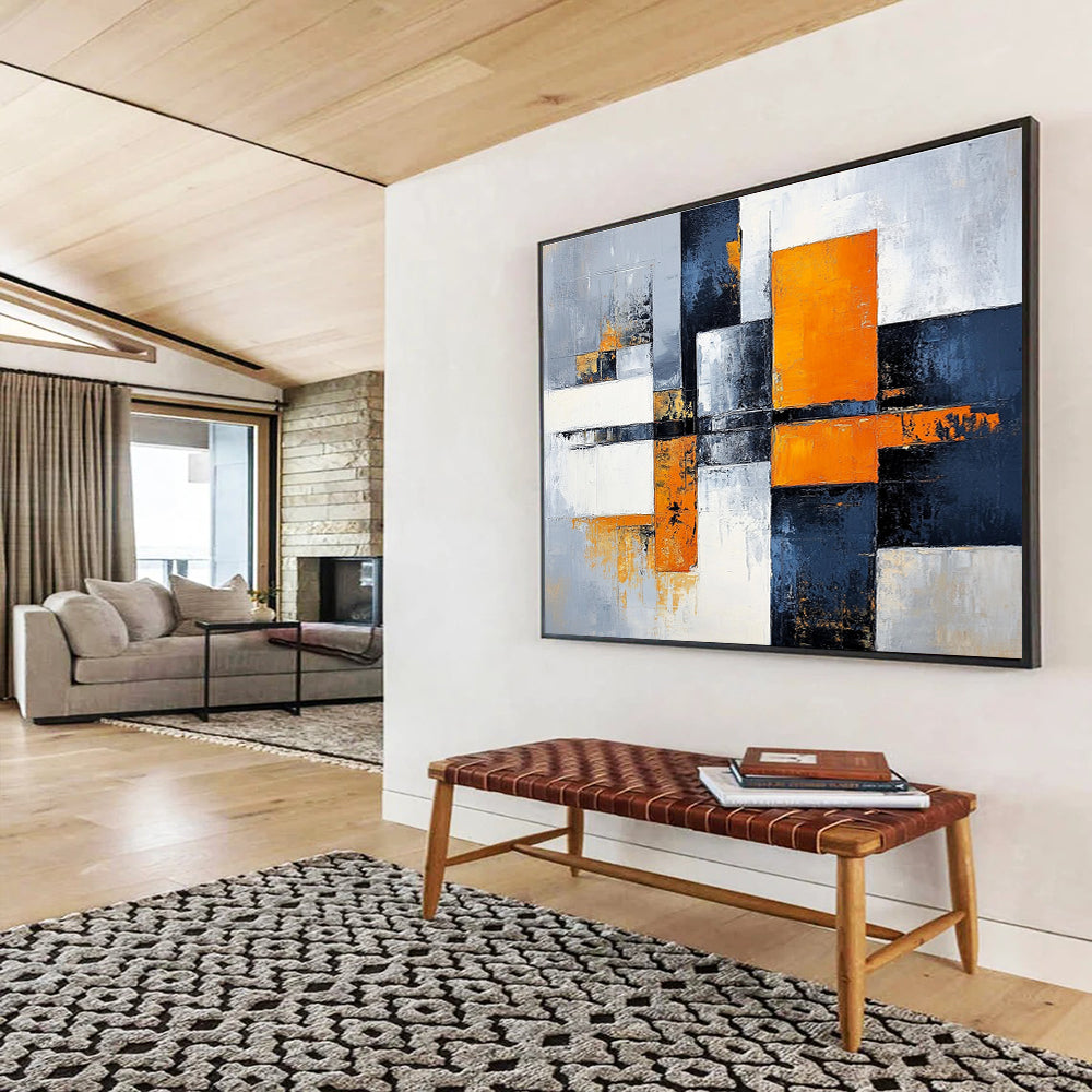 Large abstract painting featuring gray, white, and orange color blocks with a calming cityscape background, offering a sense of harmony and balance.SC100
