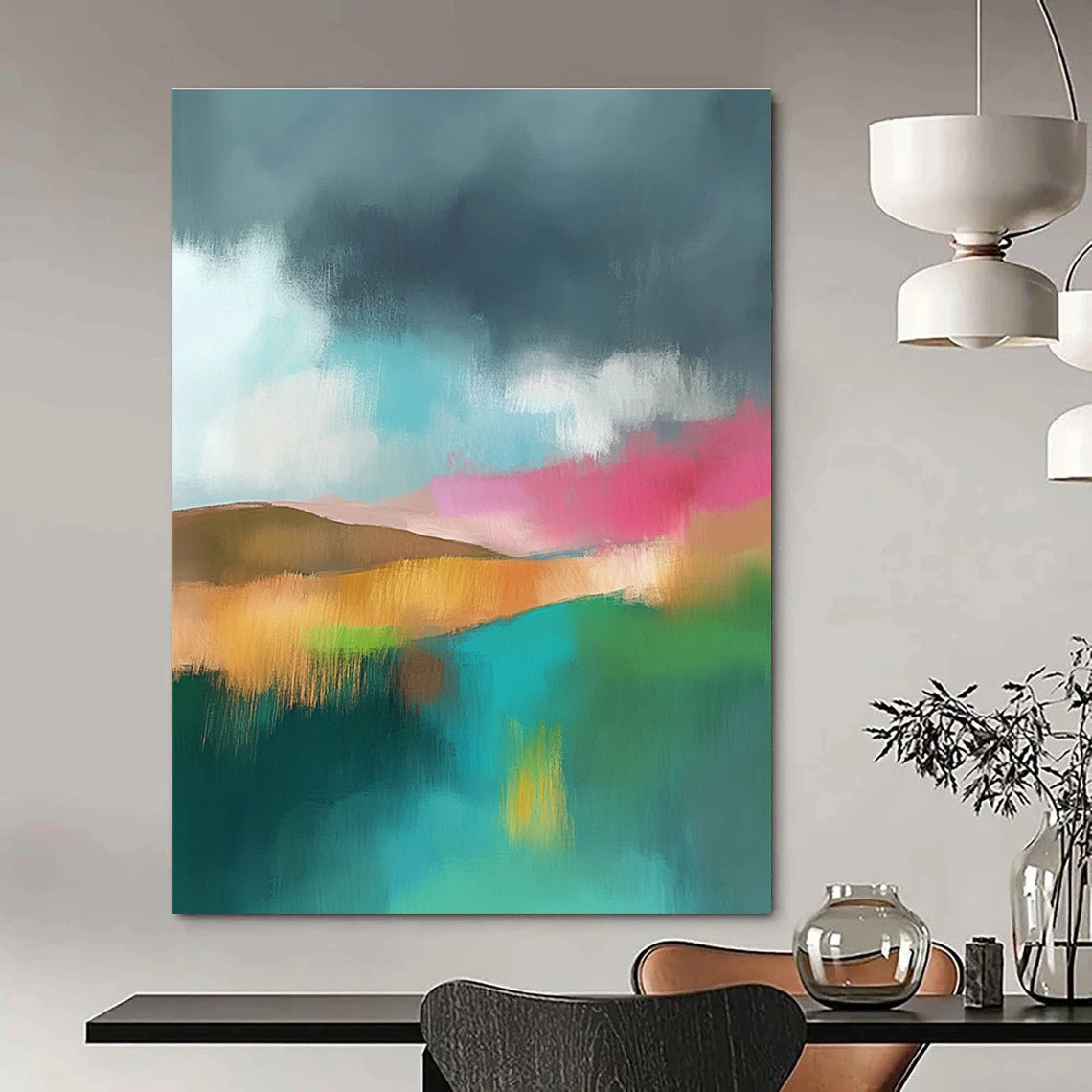 Large abstract painting featuring light teal and pink hues with a green field brown hills and a dark grey sky adorned with white clouds.STSC087