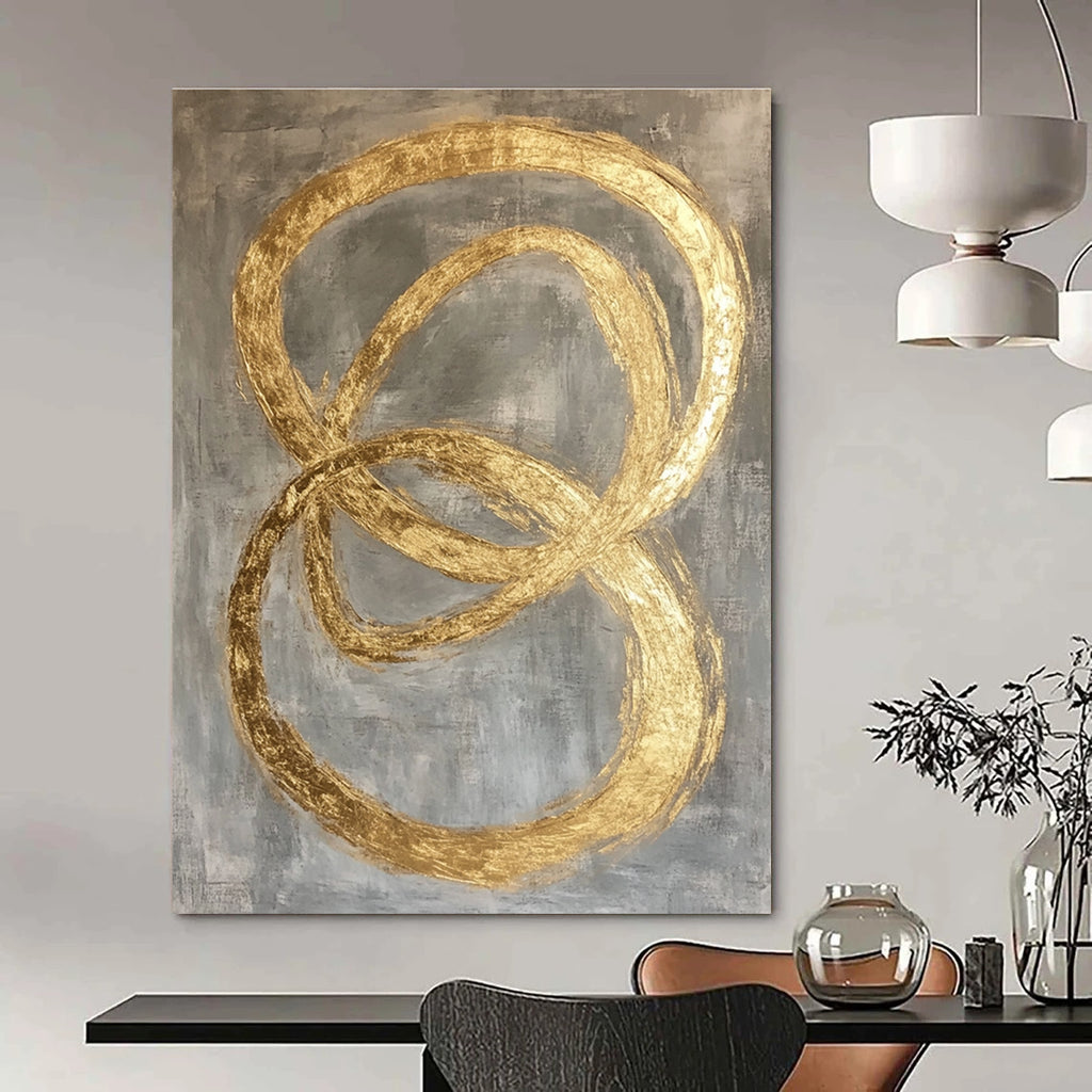 Large abstract painting featuring intertwined O-shapes in gold leaf on a modern grey background.STSC1295