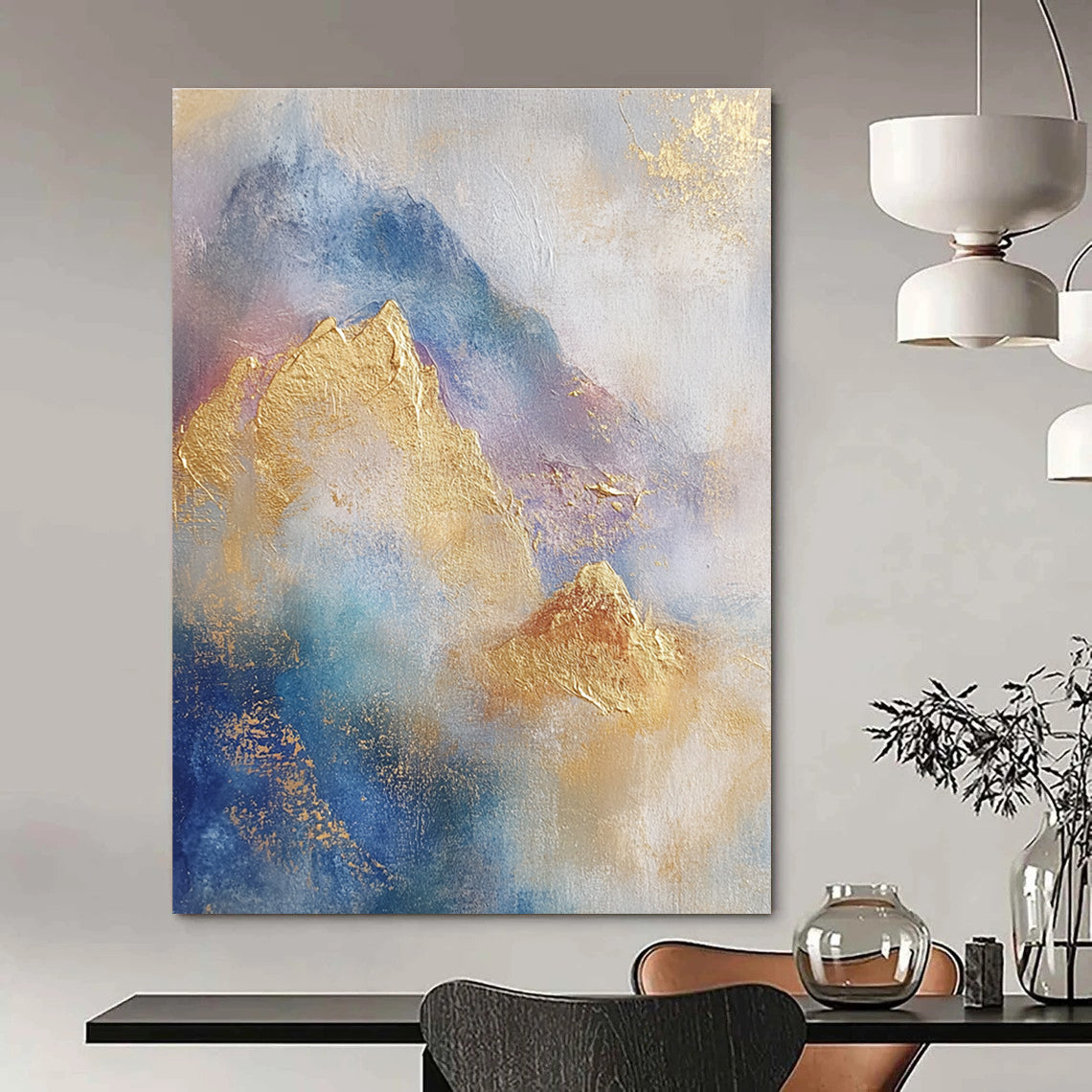 Large abstract painting featuring soft blue and gold tones with gilded mountains and textured brushstrokes for a striking visual impact.STSC446