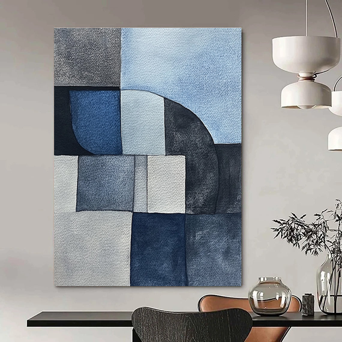 Large abstract painting features minimalistic gray-blue watercolor cubist shapes depicting sandstone rocks in a serene desert landscape.STSC240