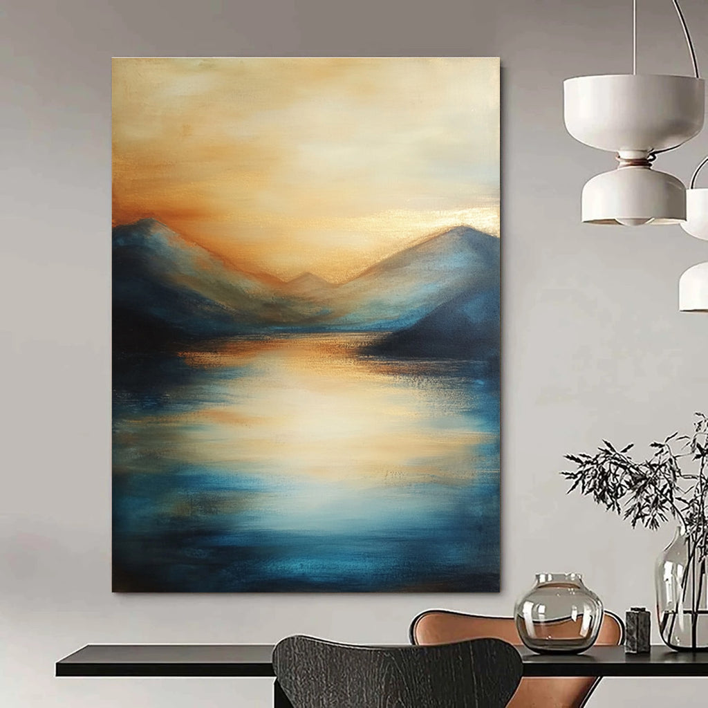 Large abstract painting of the sea featuring soft brush strokes with blue tones and golden accents creating a serene sunset atmosphere.STSC092