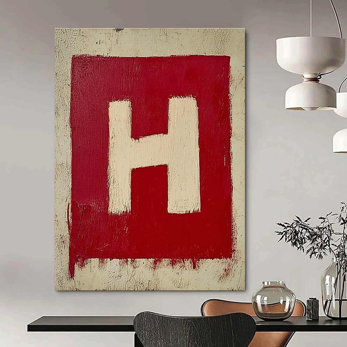 A large abstract painting featuring a minimalistic red and white letter H on textured canvas, showcasing simple brush strokes in oil paint.STSC1163