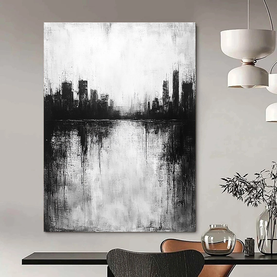Large abstract painting in black and white with city silhouette and lake reflection evokes calmness and mystery through minimalist heavy brushstrokes.STSC215