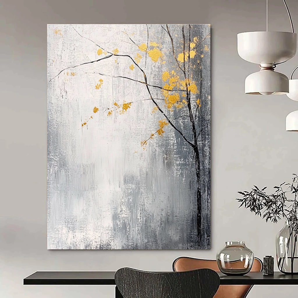 Large abstract painting with gray and white background yellow accents and delicate gold leaves creating a tranquil and mysterious atmosphere.STSC395