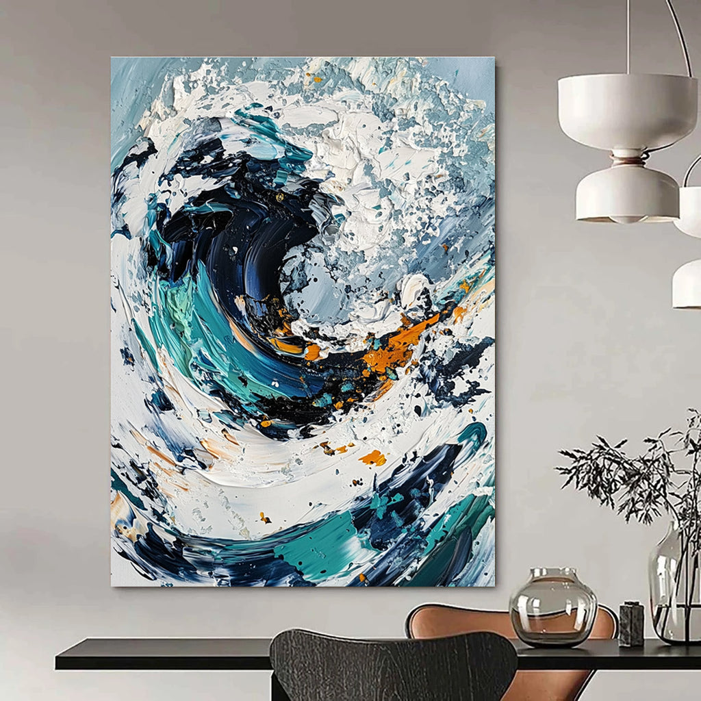Large abstract painting of an ocean wave in white and blue tones with black center and colorful details created using a palette knife on canvas.STSC263
