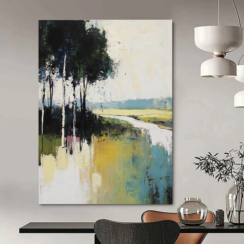 Large abstract painting featuring muted greens blues and whites depicting tranquil nature with tall trees and a serene river flowing through grassy fields.STSC100
