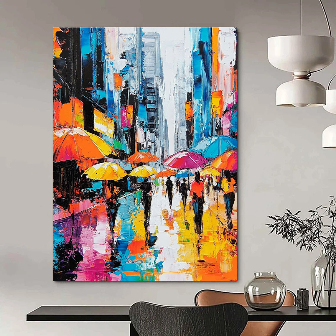 A large abstract painting depicting vibrant city streets with people under colorful umbrellas and towering skyscrapers highlighting urban energy and movement.STSC872