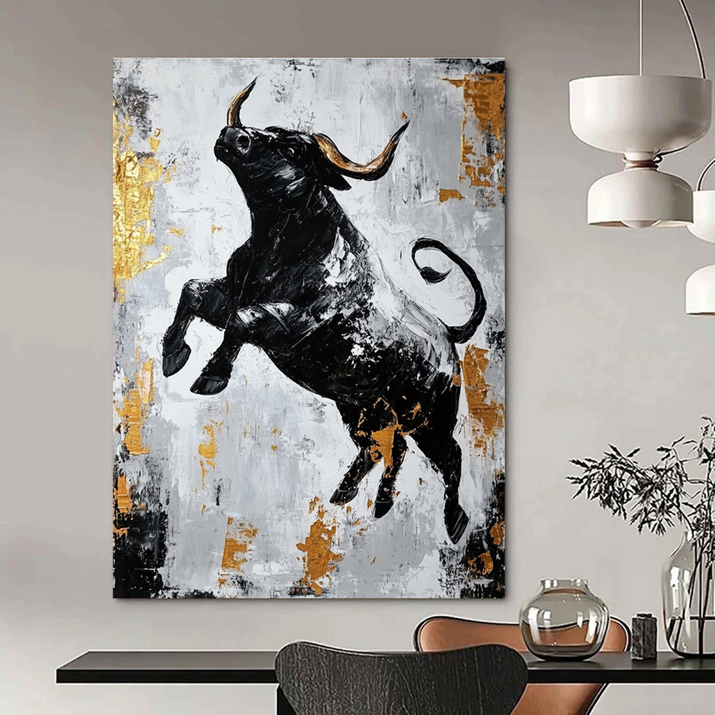 Large abstract painting featuring a dynamic black bull in gold and gray with strong contrasts and rough brushstrokes conveying powerful strength.STSC913