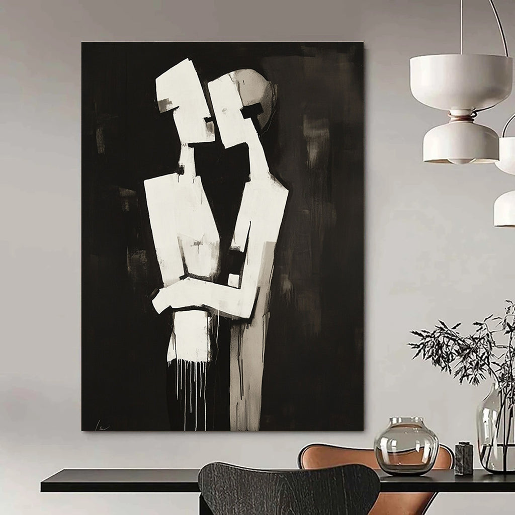 Abstract black and white painting of two figures embracing in a deconstructed minimalist style against a dark background.STSC024