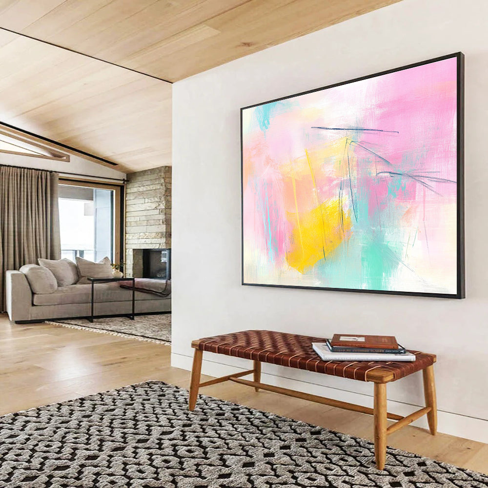 Large abstract painting featuring pink and yellow tones light blue lines and soft shapes creating a dreamy atmosphere with delicate brushstrokes and pastel background.SC211