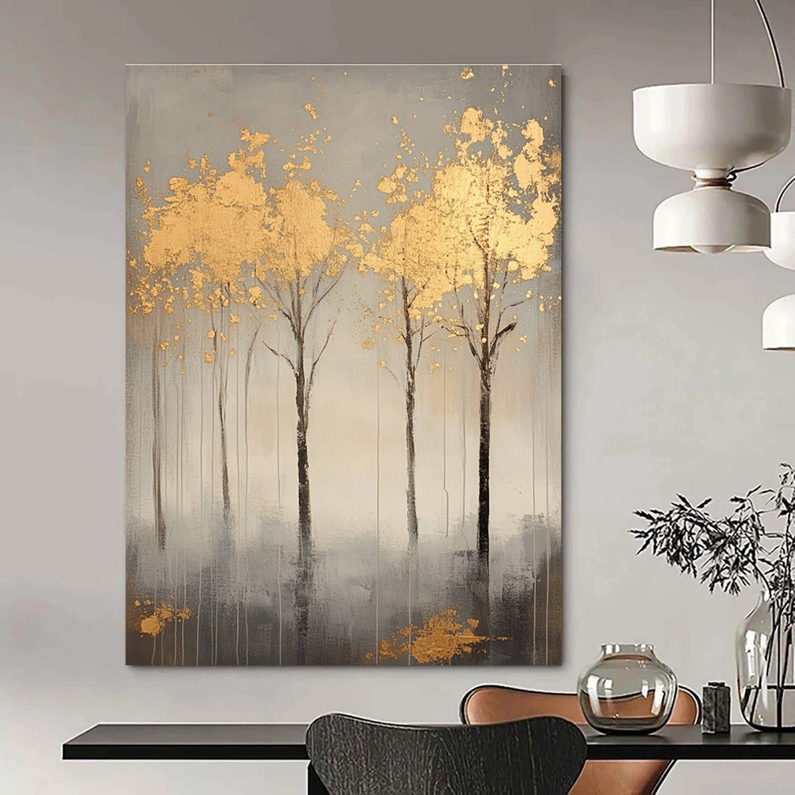 A large abstract painting featuring serene gray trees with gold leaf accents creating a tranquil atmosphere and evoking nature's beauty.STSC1174
