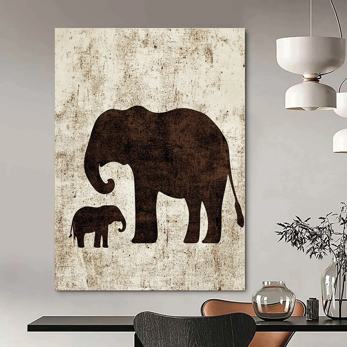 A large abstract artwork featuring minimalist silhouettes of an elephant and a baby elephant in textured brown ink on white paper.STSC1095